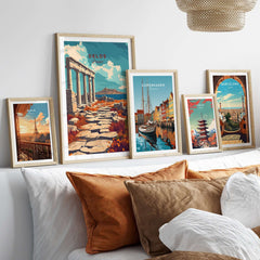 Delos Travel Print and other travel-themed framed prints displayed in a cozy interior setting.