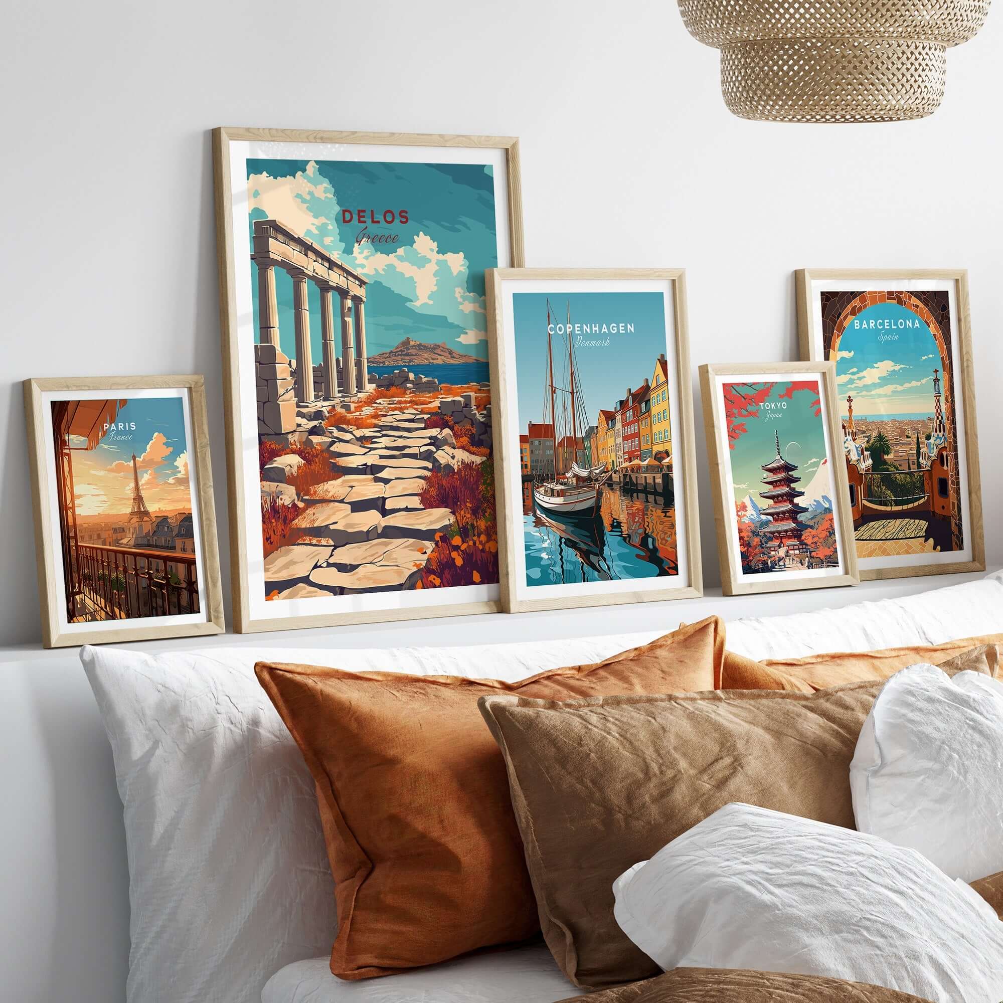 Delos Travel Print and other travel-themed framed prints displayed in a cozy interior setting.