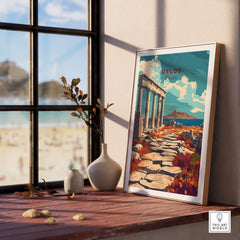 Delos Travel Print displayed on a windowsill with a beach view, inspiring wanderlust and adventure.