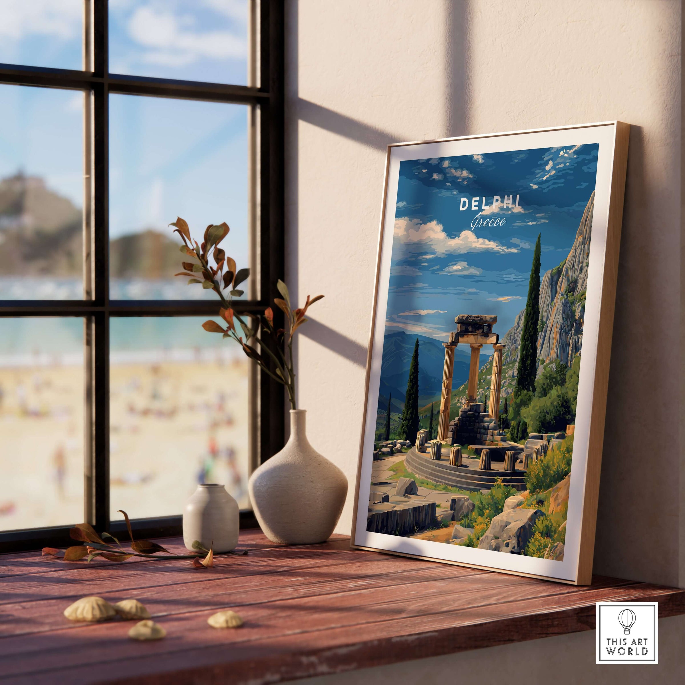 Delphi Print | Historic Greek Wall Decor displayed on a table near a window with a beach view.
