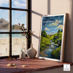 Derbyshire Countryside Print - England Green Hills Wall Art - River & Fields Travel Poster on a mantel.