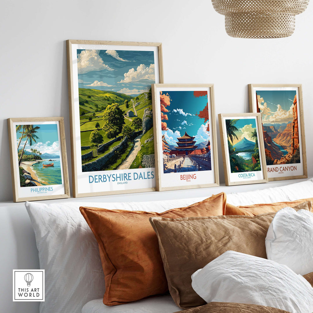 Framed Derbyshire Dales poster and travel art prints displayed on a stylish shelf in a cozy living room setting.