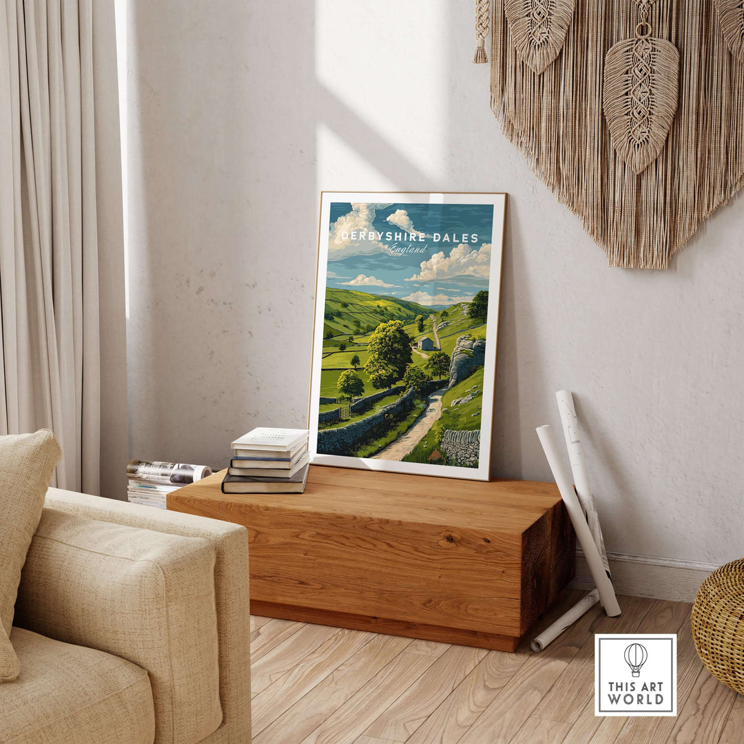 Derbyshire Dales farmhouse wall art print featuring green fields and hills in a cozy interior setting.