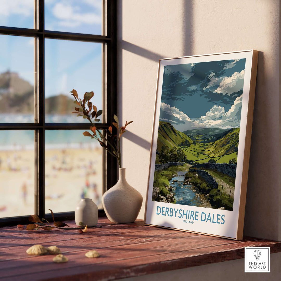 Derbyshire Dales Valley art print featuring rolling hills and stream, displayed in a cozy home setting.