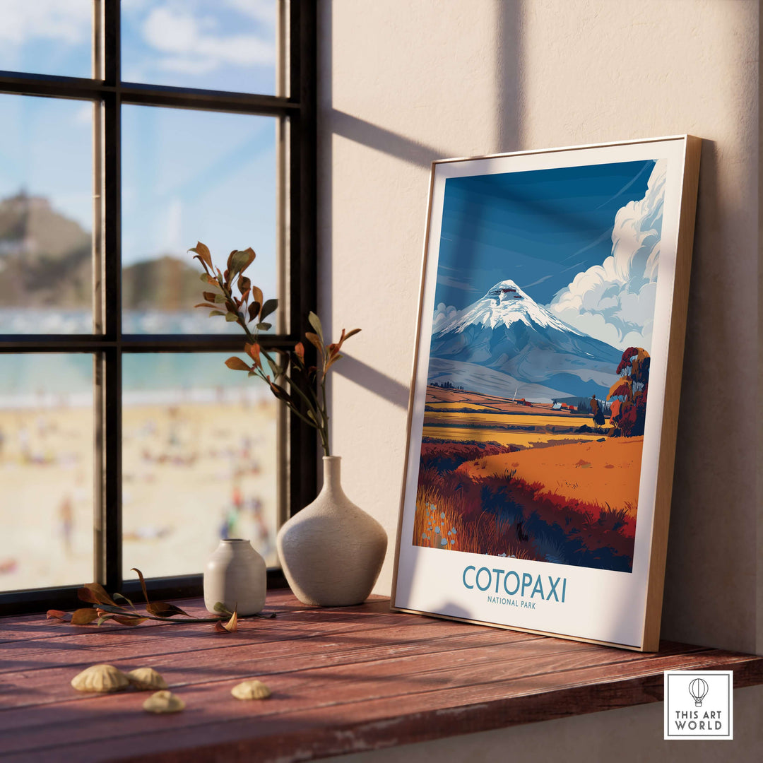 Ecuador Cotopaxi volcano landscape poster displayed in a sunny interior with a beach view.