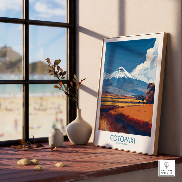Ecuador Cotopaxi volcano landscape poster displayed in a sunny interior with a beach view.