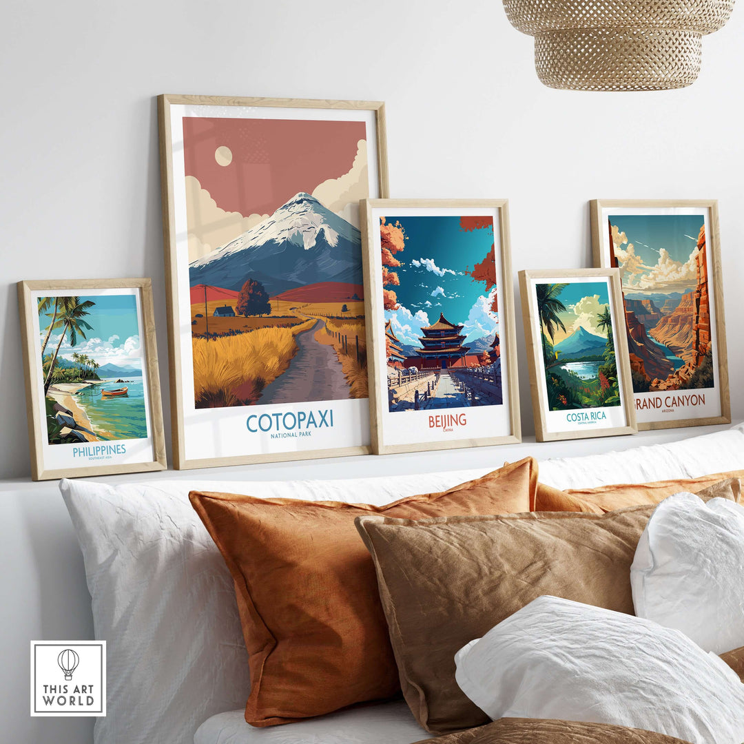 Ecuador Cotopaxi travel poster among framed landscape prints of global destinations on a stylish living room wall.