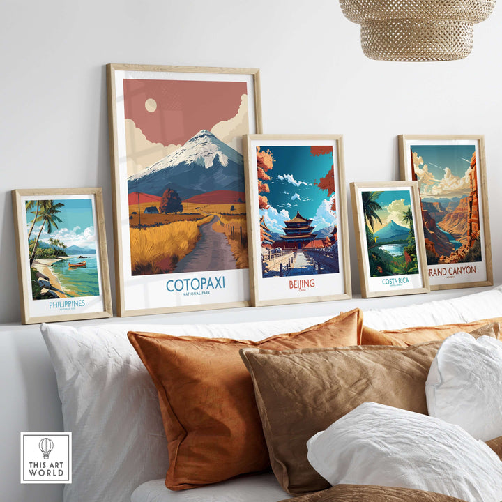 Ecuador Cotopaxi travel poster among framed landscape prints of global destinations on a stylish living room wall.
