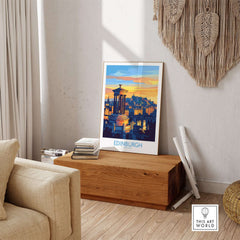 Edinburgh Travel Poster displayed in a cozy interior setting, showcasing iconic landmarks of Edinburgh.
