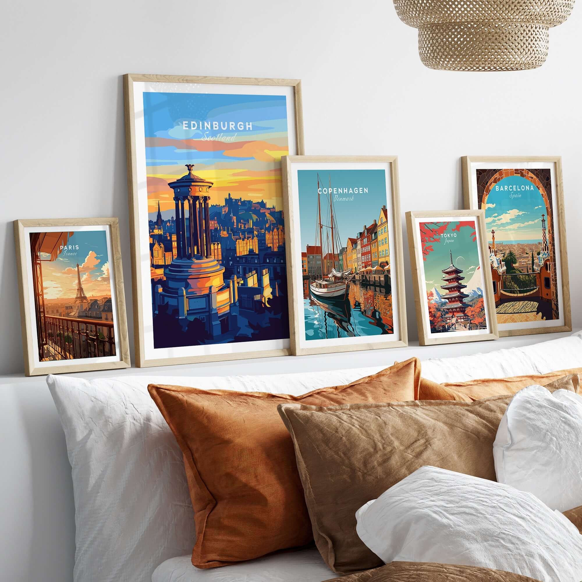 Edinburgh Travel Print showcased among other city travel prints in elegant frames on a stylish bed decoration.