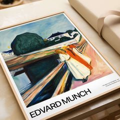 Edvard Munch Art Print - The Girls on the Bridge 1927 Painting - Museum Poster displayed in a frame on a table.