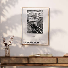 Edvard Munch The Scream 1895 Lithograph Art Print Expressionist Poster framed on a wall above a wooden console.