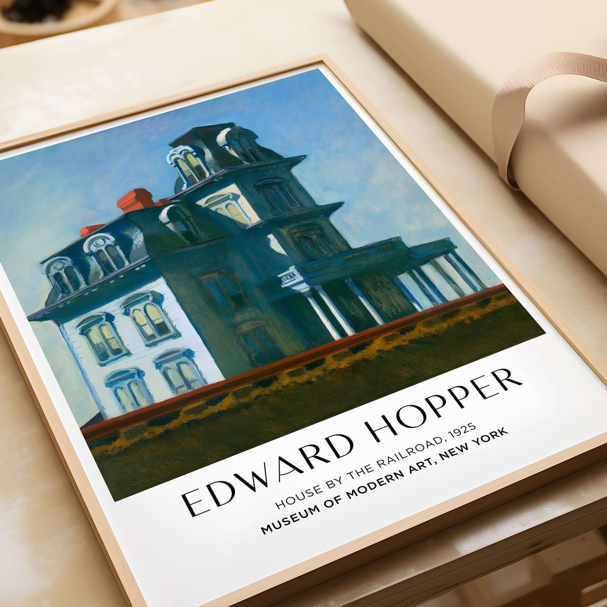Edward Hopper House by the Railroad 1925 MoMA Art Print Poster in a framed display.