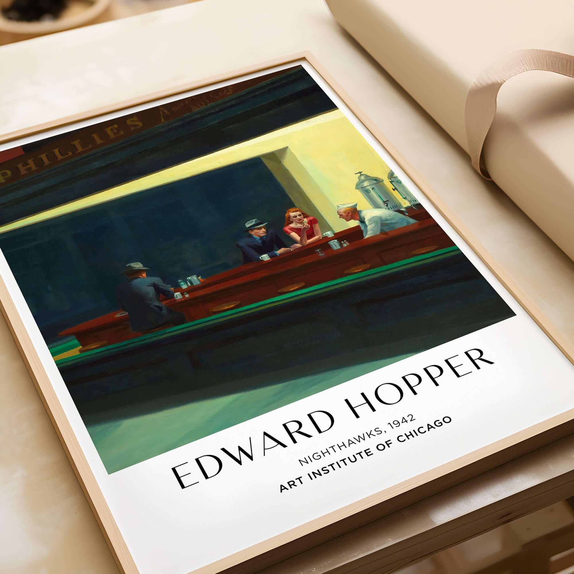 Edward Hopper Nighthawks 1942 Iconic Diner Art Print AIC Poster displayed in a modern frame.
