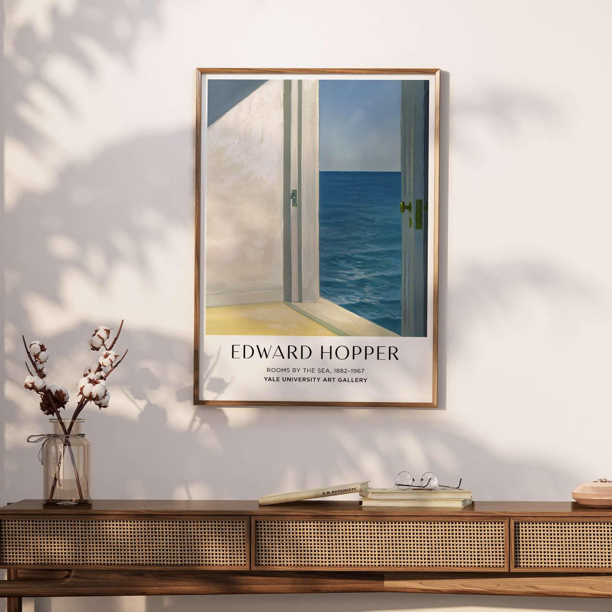 Edward Hopper Rooms by the Sea 1951 Yale University Art Print Poster framed on a wall above a wooden table.