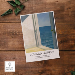 Edward Hopper Rooms by the Sea 1951 Yale University Art Print Poster displayed on a wooden surface.