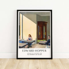 Edward Hopper Sunlight in a Cafeteria 1958 Yale Art Gallery Print displayed in a modern frame on a wooden floor.