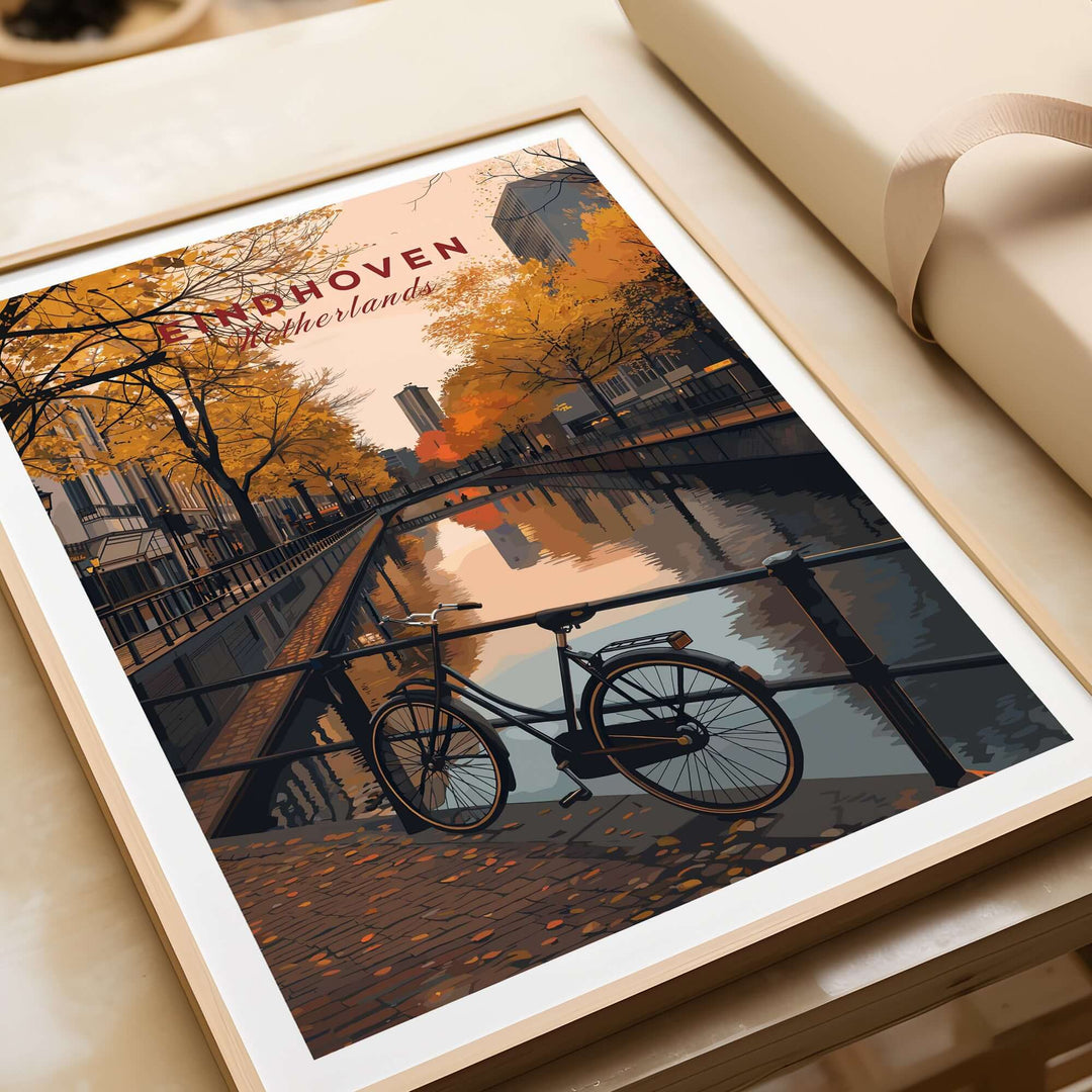 Eindhoven Print | Netherlands Home Decor Walll Art featuring a bike by a canal in autumn.