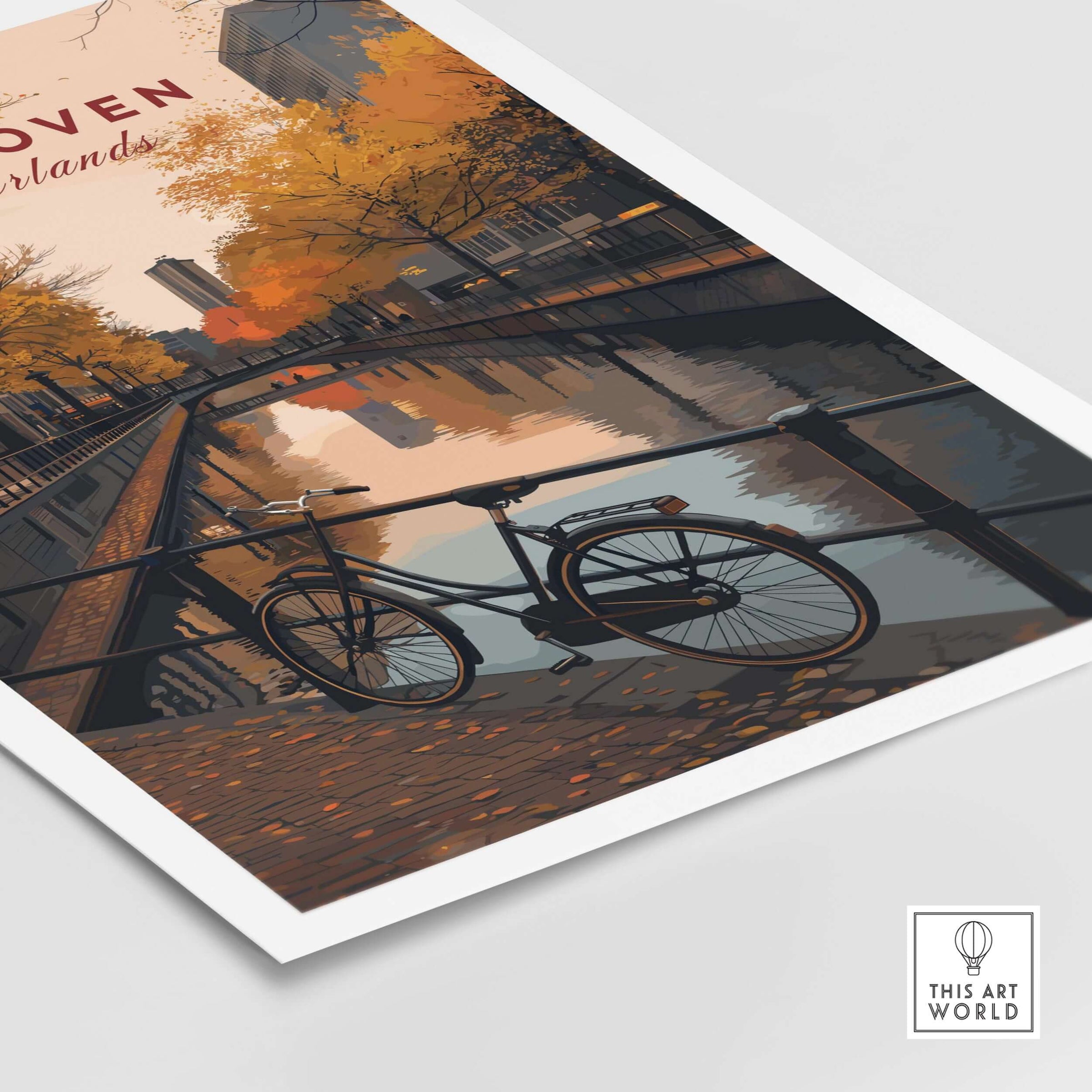 Eindhoven Print | Netherlands Home Decor Walll Art featuring a bicycle near a canal with autumn foliage.
