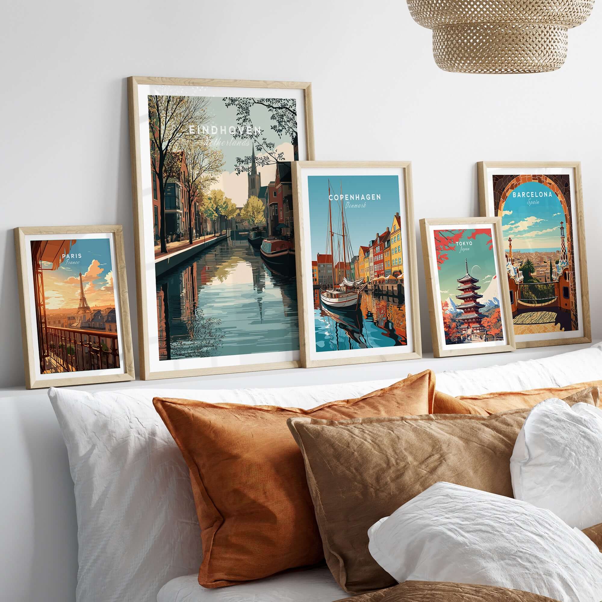 Eindhoven Print | Dutch City Wall Decor displayed among other city prints on a stylish sofa.