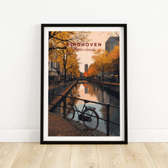 Eindhoven Print | Netherlands Home Decor Walll Art featuring a serene canal scene with autumn trees and a bicycle.