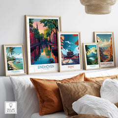 Eindhoven Art Print | Urban Sunset Reflections Poster displayed alongside other city art prints on a cozy couch.