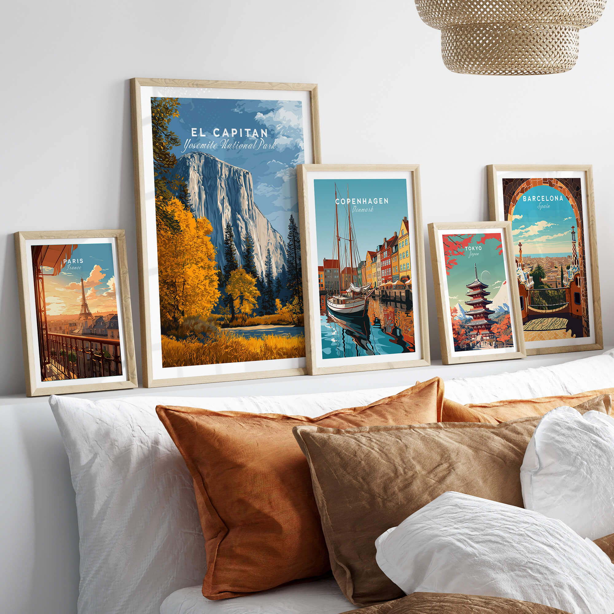 El Capitan Travel Poster – Yosemite National Park Granite Monolith Art framed among travel posters on a couch.