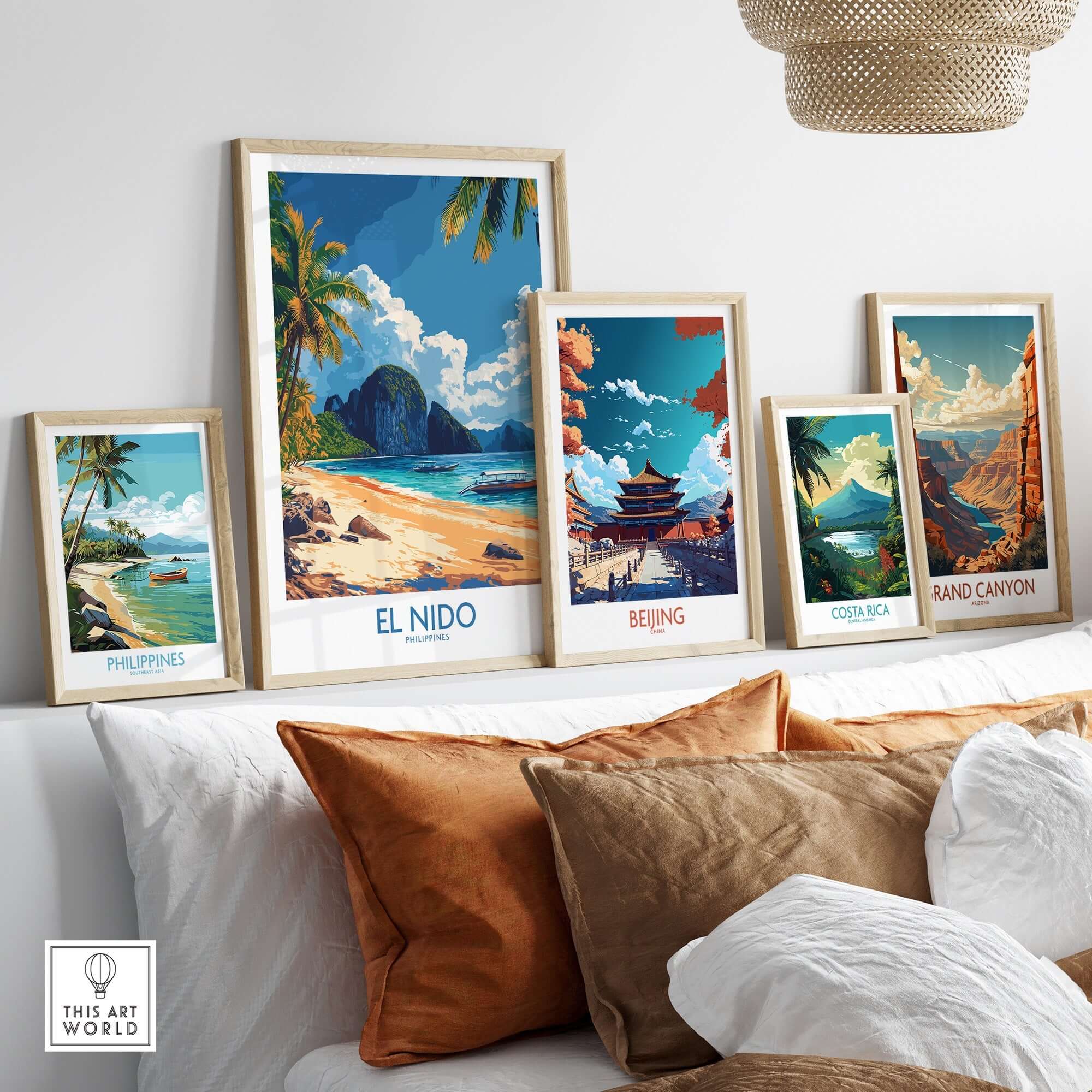 El Nido Wall Art Print Philippines showcased among other travel-themed art prints on a cozy couch.