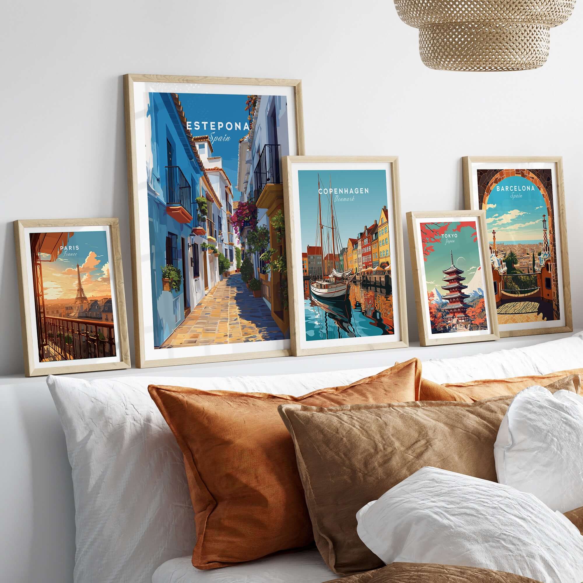 Estepona Flower Alley Print | Mediterranean Travel Wall Art displayed among other travel prints on a cozy sofa.