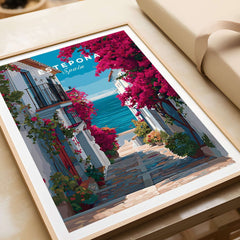 Estepona Old Town Sea View Print | Mediterranean White Village Decor displayed on a table with vibrant colors.