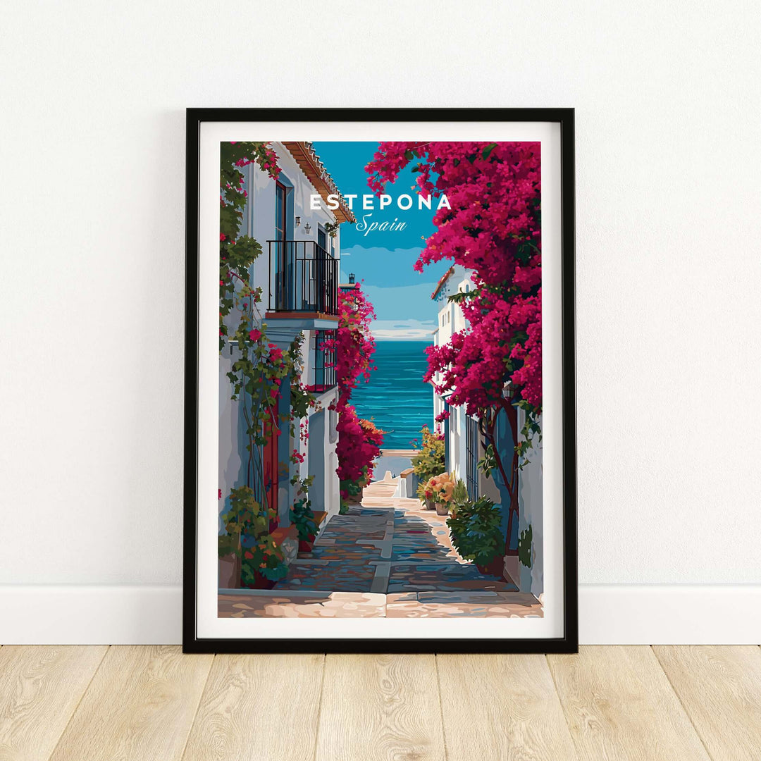 Estepona Old Town Sea View Print | Mediterranean White Village Decor framed print showcasing a coastal street with vibrant flowers.