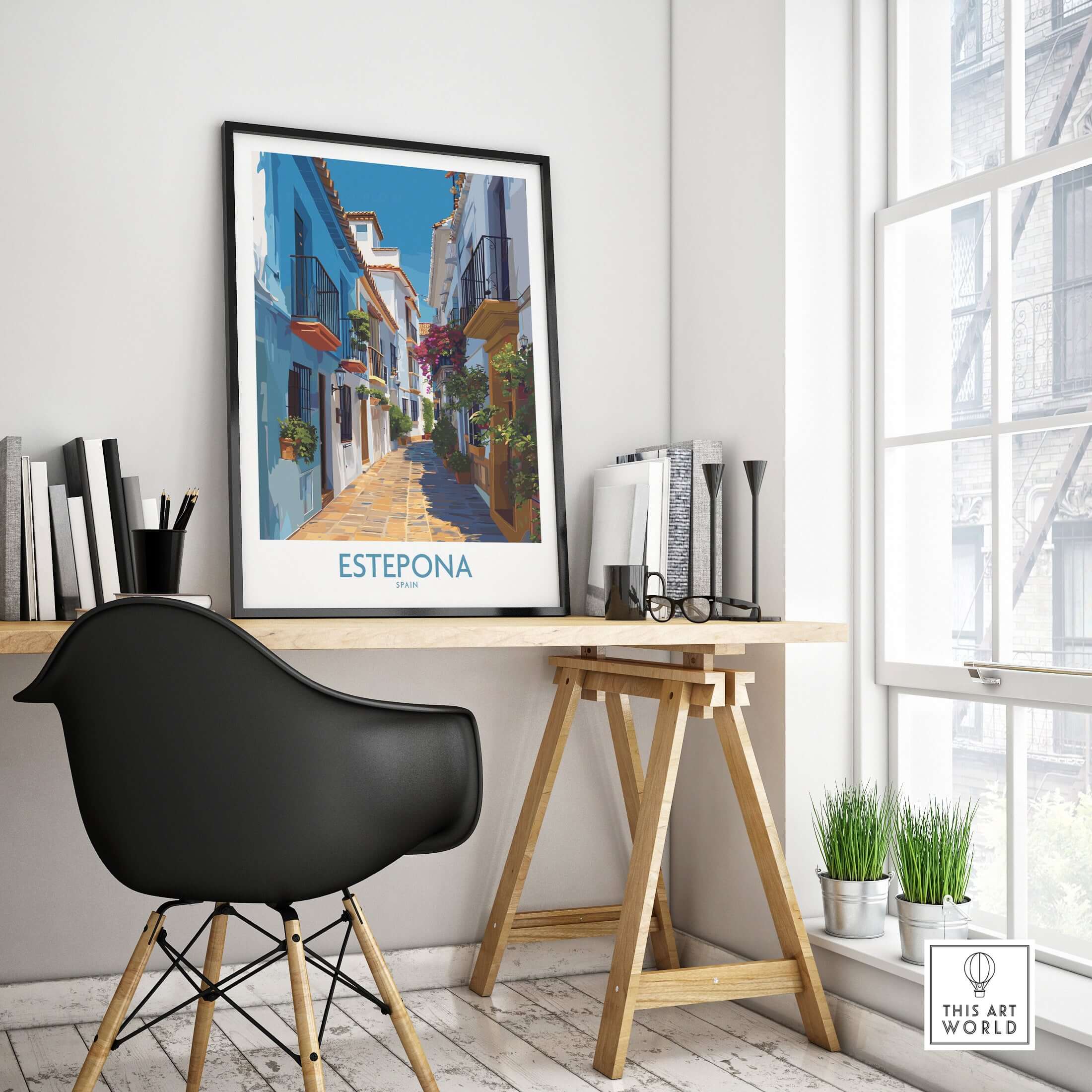 Estepona Spain Art Print | Spanish Architecture Poster displayed in a modern workspace with plants and books.