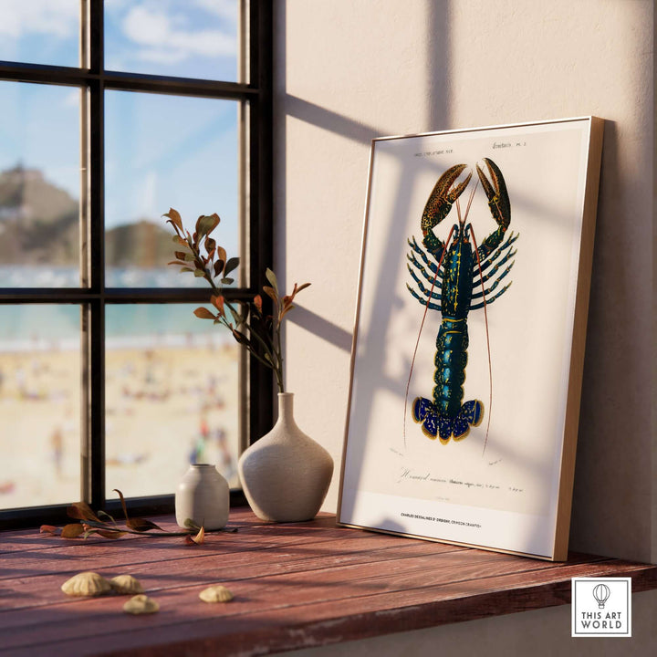 Framed vintage lobster illustration by Charles d'Orbigny displayed on a wooden table near a window.