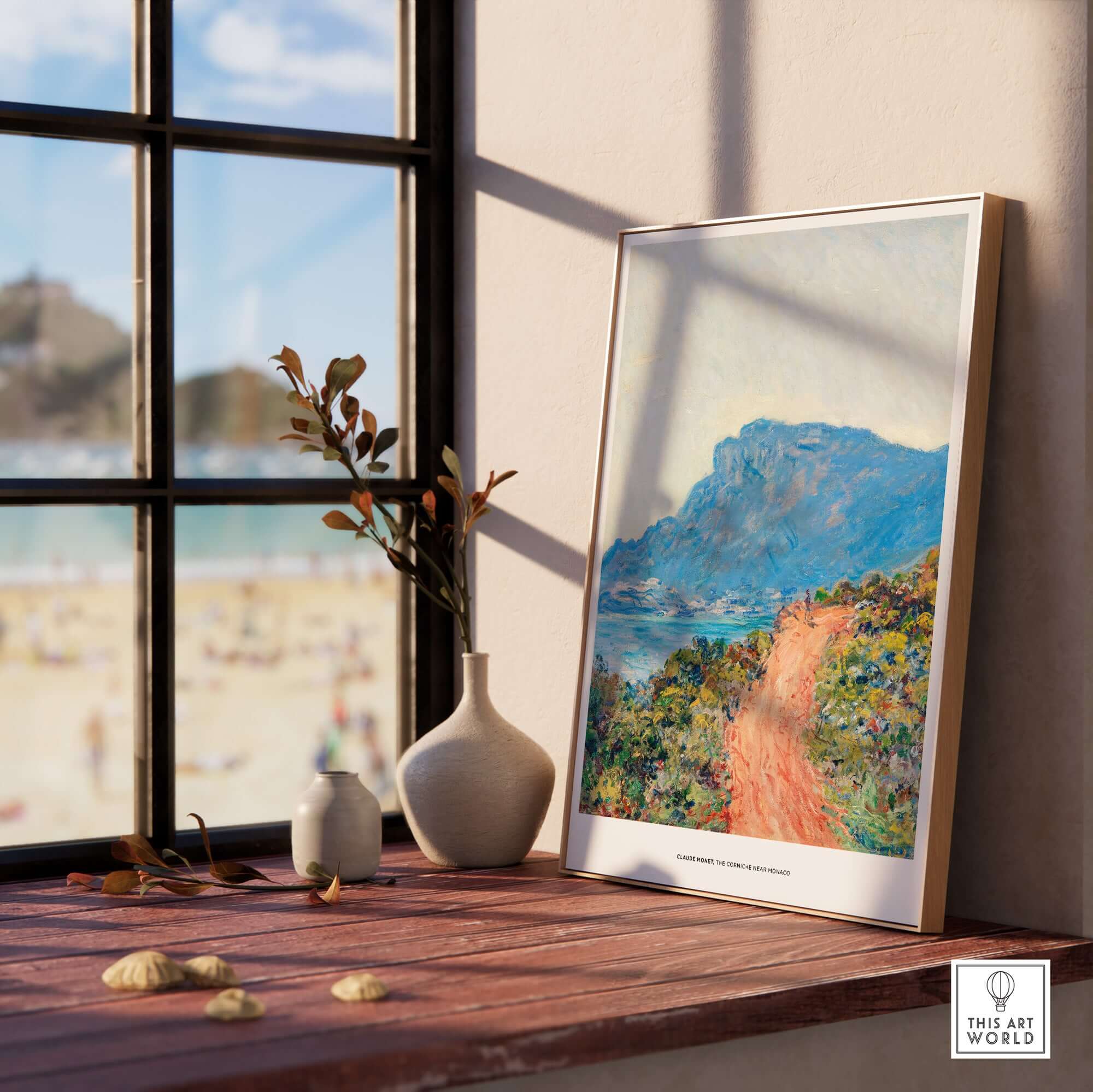 Exhibition Art Print Claude Monet The Corniche near Monaco Impressionist Landscape Poster displayed by a sunny window.