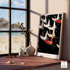 Exhibition Art Print Myriad of Flying Cranes Japanese Bird Pattern Poster Wall Art displayed in a modern interior with beach view.
