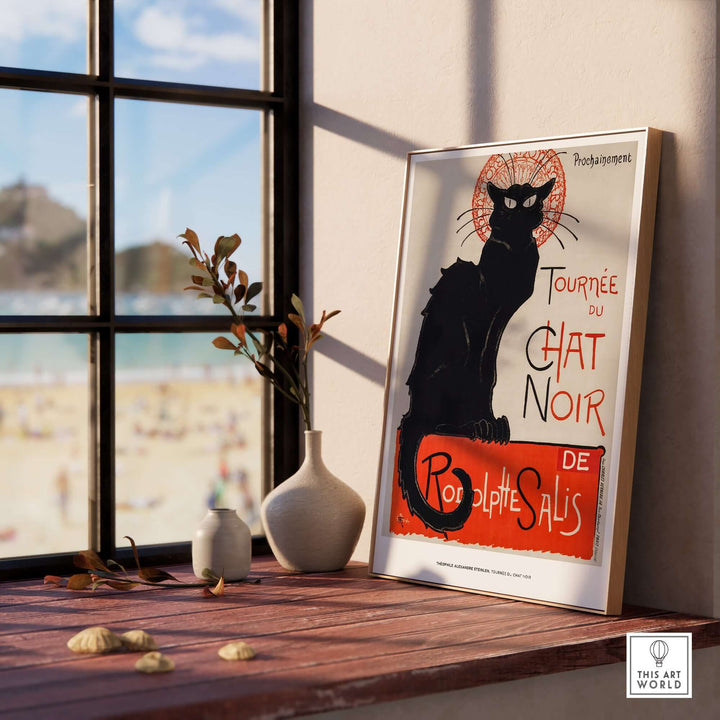 Vintage French poster 'Tournée du Chat Noir' featuring a black cat by Steinlen, styled in a chic interior.