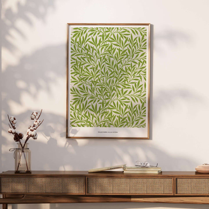 William Morris Willow Pattern green botanical art print displayed on a wall above a stylish wooden console.