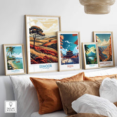 Exmoor Poster displayed among framed prints of various landscapes on a stylish shelf.