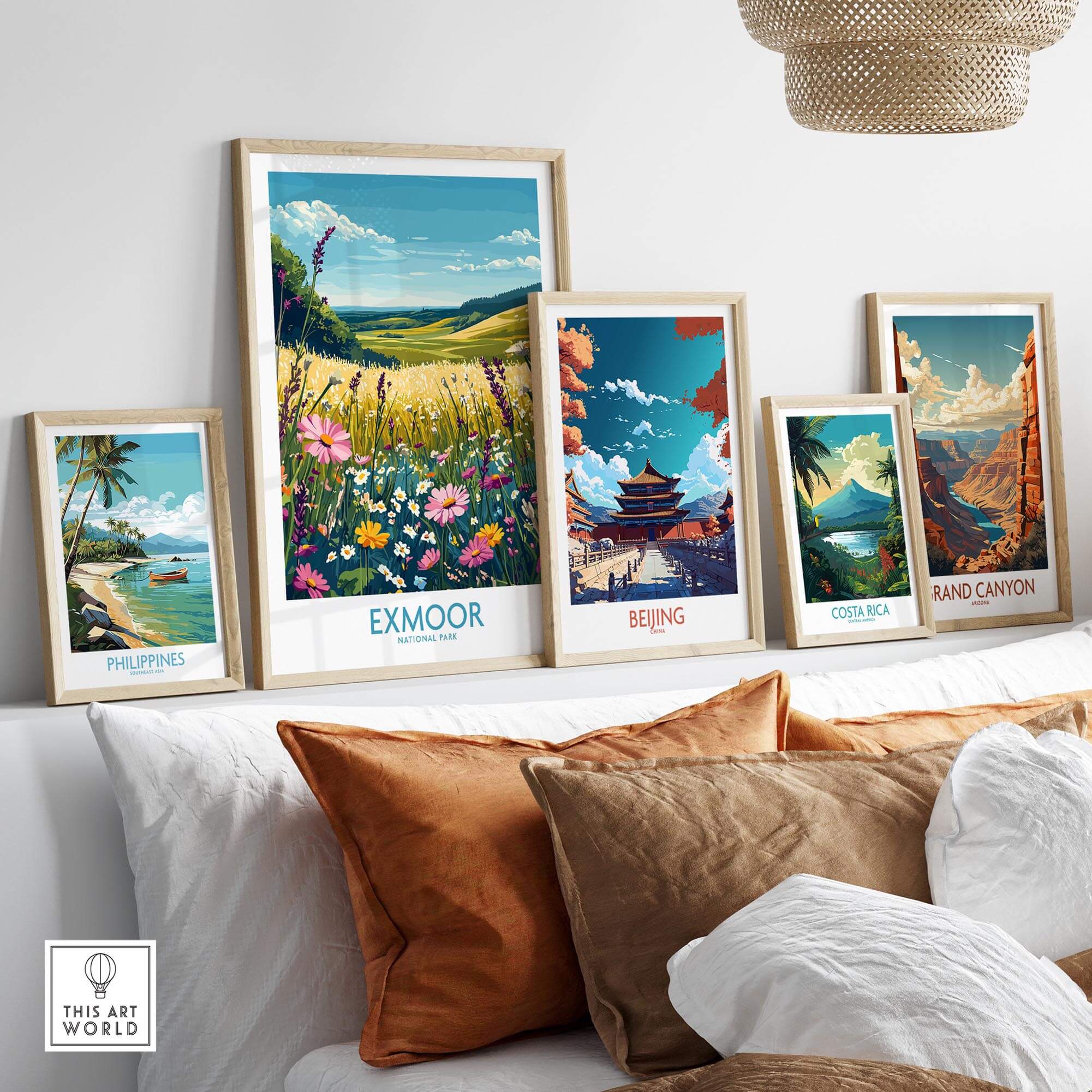 Exmoor Poster National Park displayed among vibrant travel prints on a cozy sofa, showcasing global destinations.