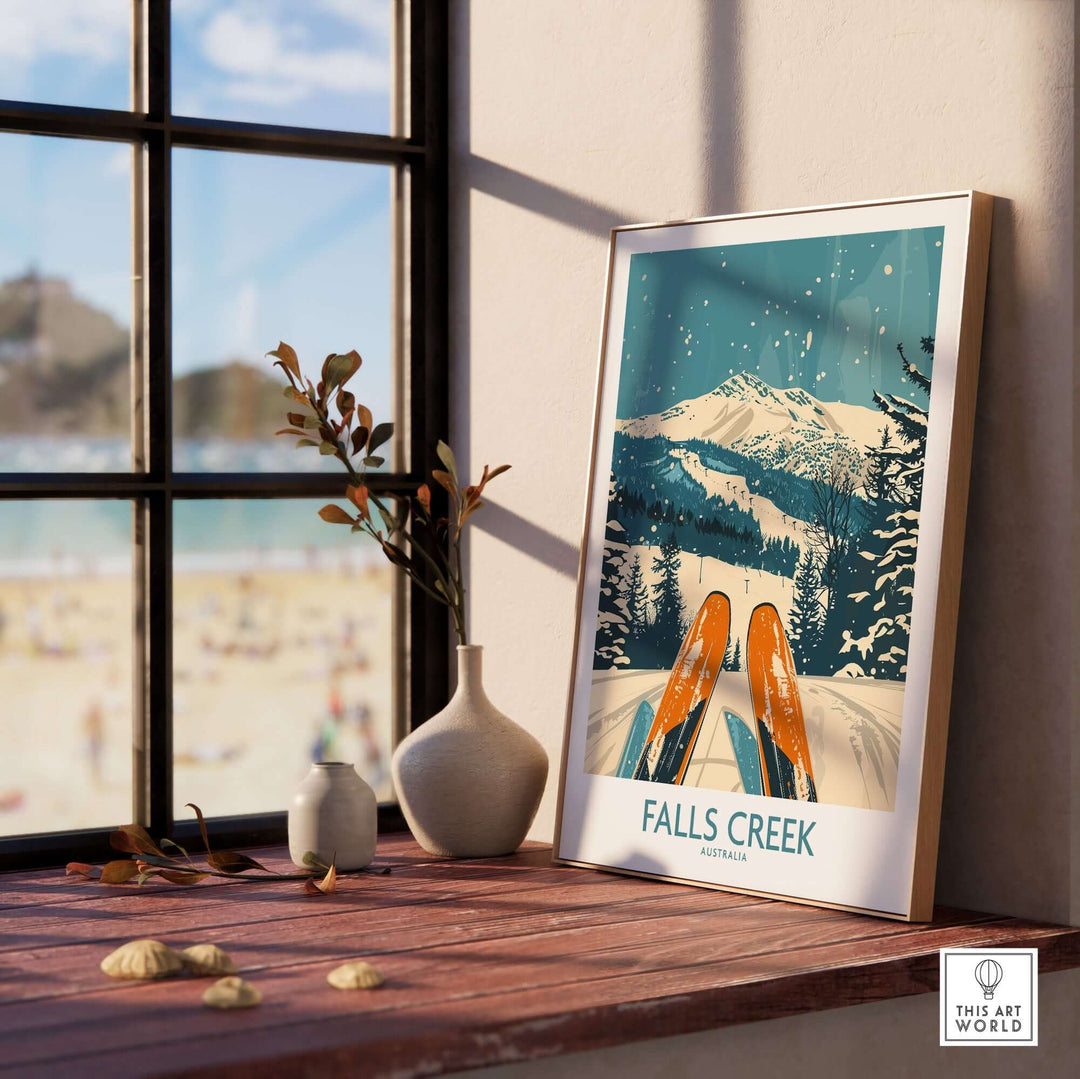 Framed Falls Creek ski poster displayed on a windowsill with mountain scenery and ski design, perfect home decor.