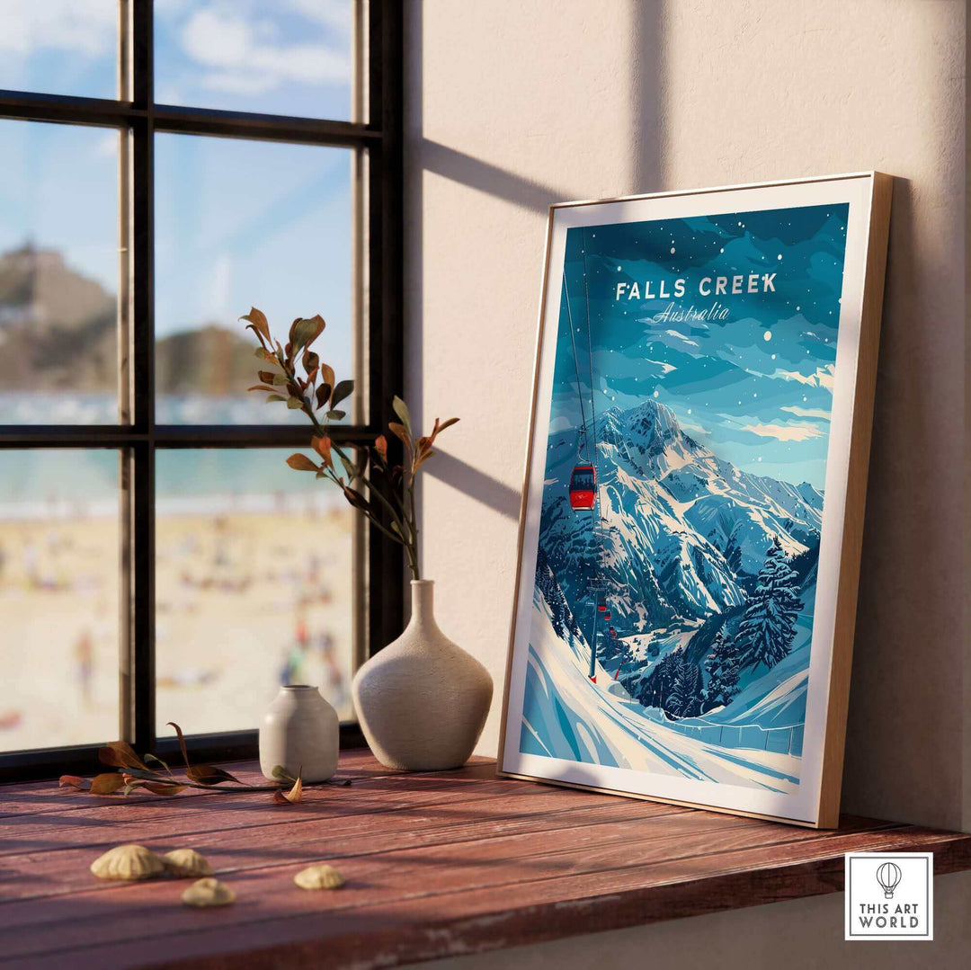 Falls Creek travel poster displayed by a window, showcasing ski slopes and mountain scenery, perfect for winter decor.