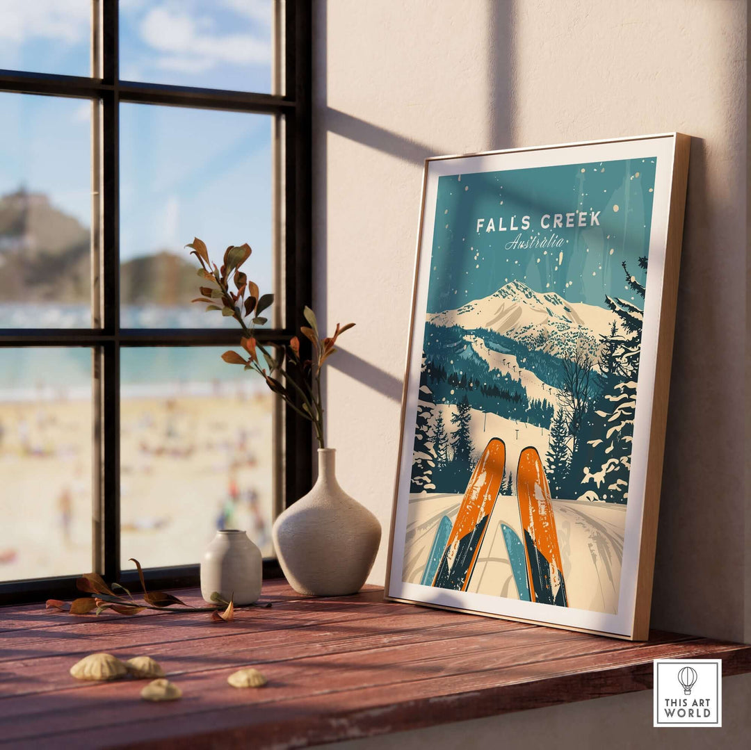 Falls Creek ski poster wall art in frame by window, showcasing snowy mountain landscape in Australia with decorative vases nearby.