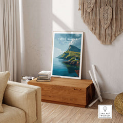 Faroe Islands Art Print | Denmark Poster displayed in a cozy living room setting on a wooden table.