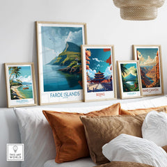 Faroe Islands Print | Dramatic Cliffs Travel Poster displayed among other travel-themed posters on a cozy sofa.