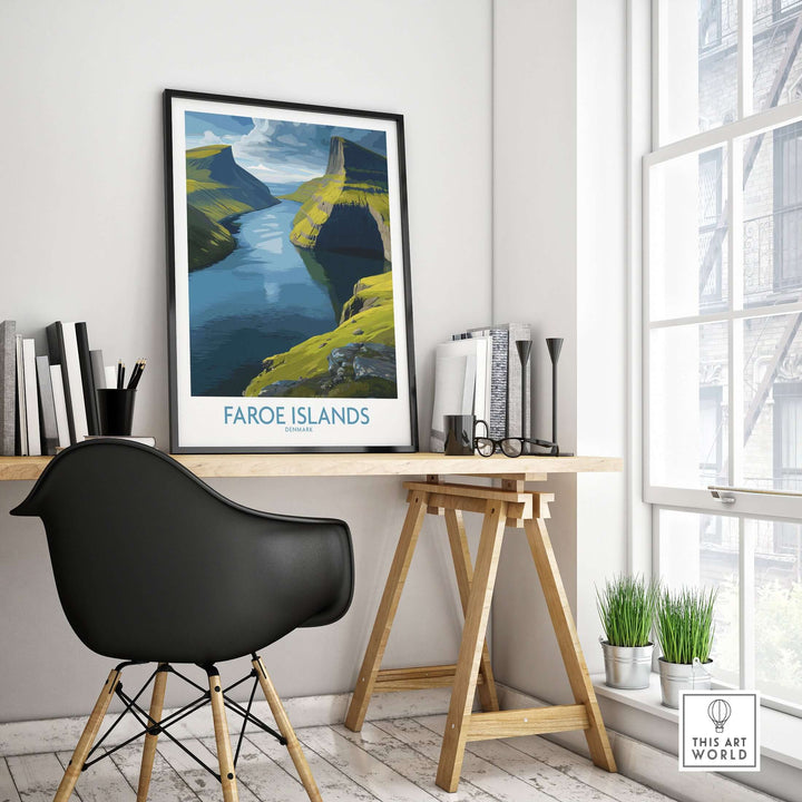 Faroe Islands Fjord Landscape Art Print displayed in a modern workspace with a sleek chair and desk.