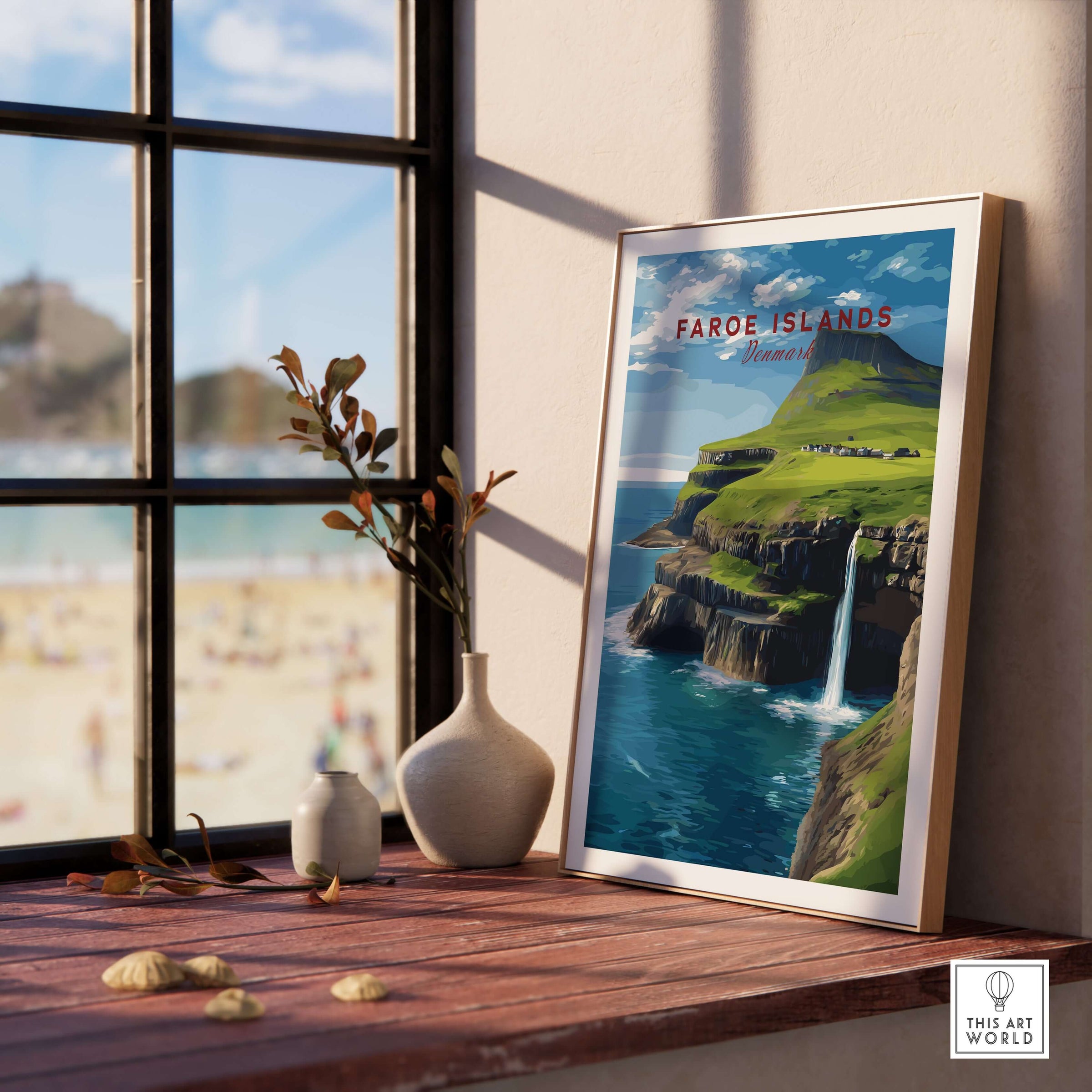 Faroe Islands Gásadalur Waterfall View Print | Nordic Nature Wall Decor displayed on a windowsill with beach view.