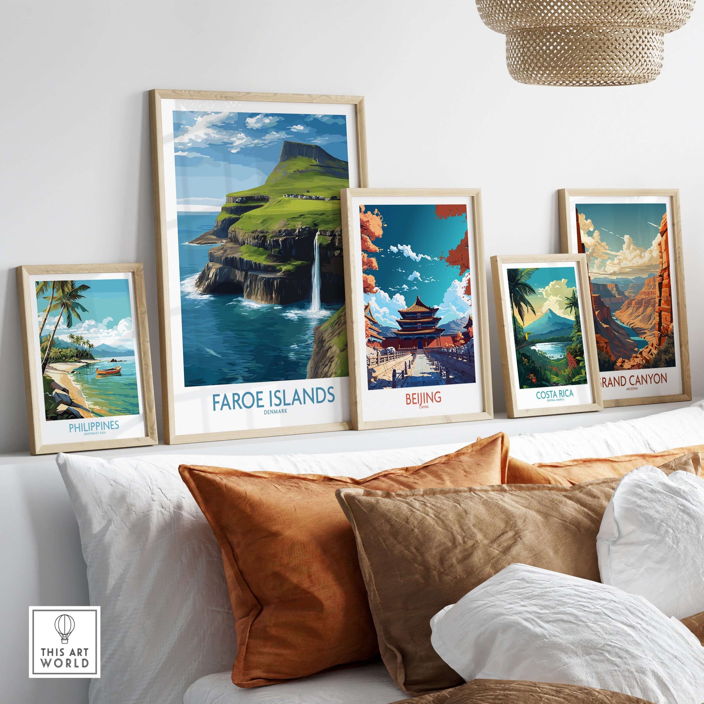 Faroe Islands Waterfall Art Print | Denmark Poster displayed among other travel art prints on a cozy sofa.
