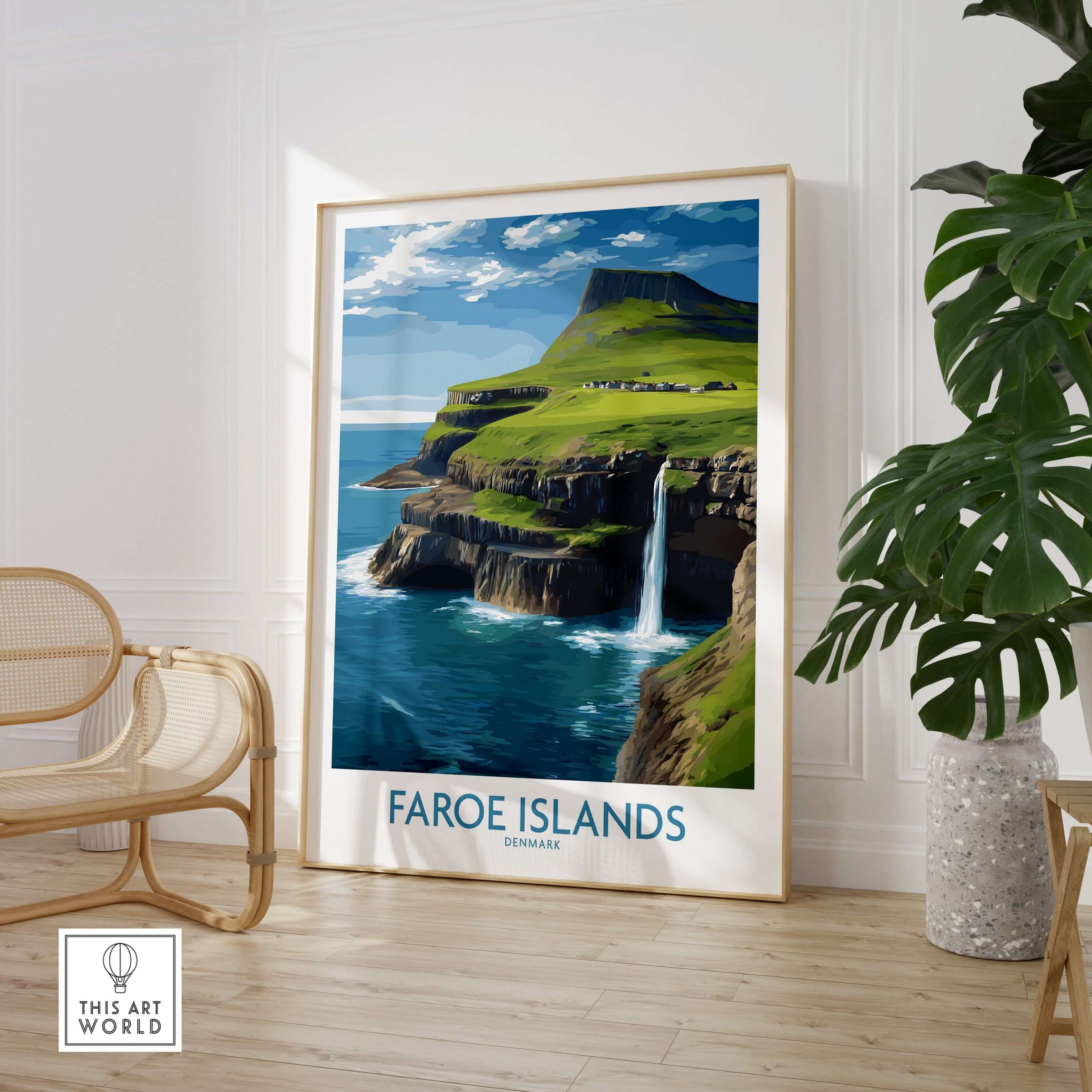 Faroe Islands Waterfall Art Print | Denmark Poster displayed in a modern home interior with a decorative chair.