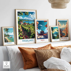 Finger Lakes Poster - Wine Region framed among travel posters on a cozy sofa.