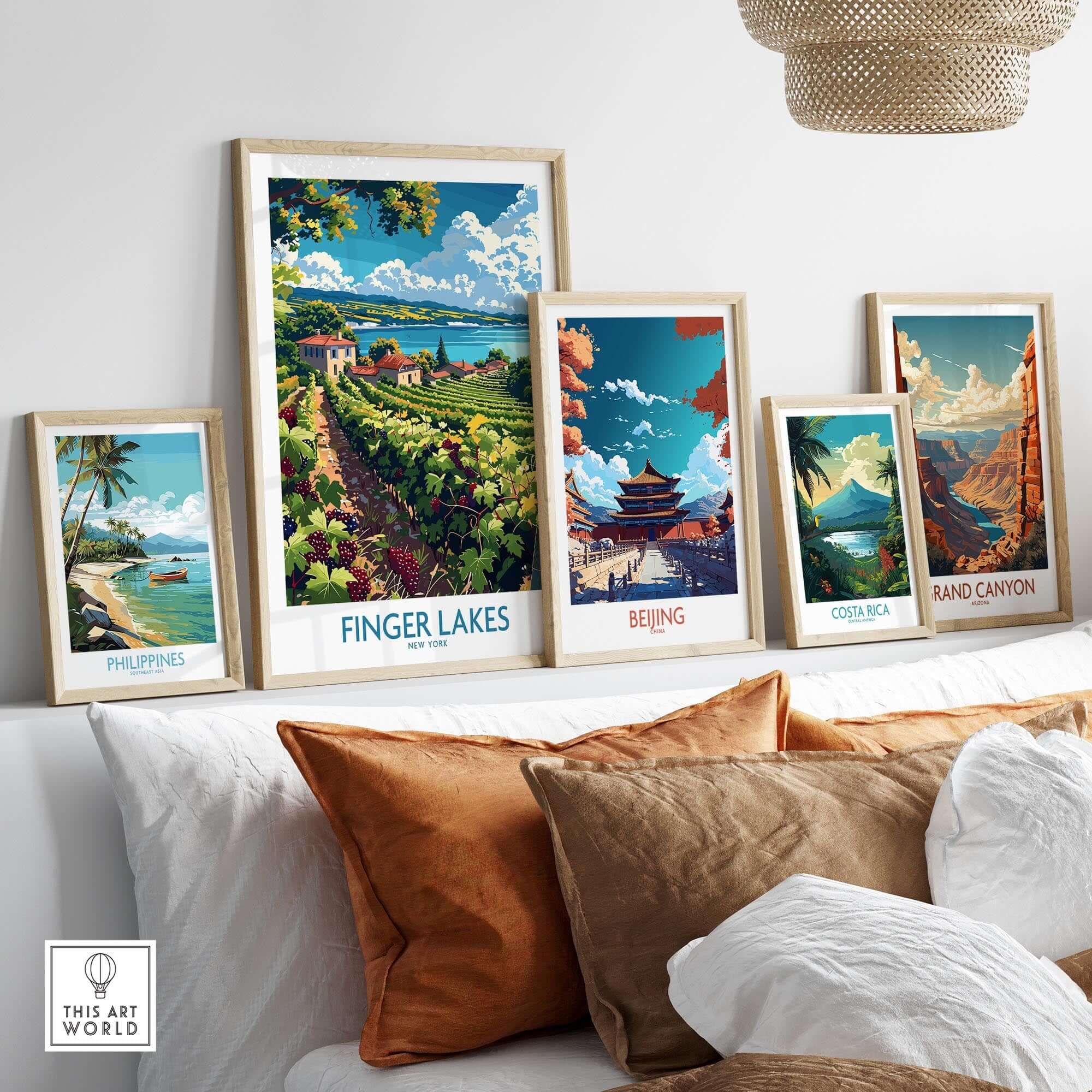 Finger Lakes Poster - Wine Region framed among travel posters on a cozy sofa.